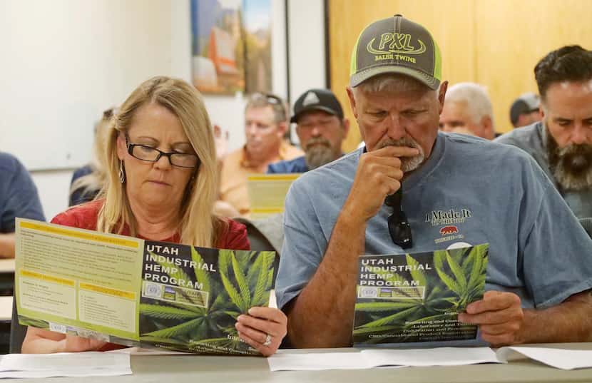 FILE - Alfalfa farmers Diane and Russ Jones look on during a public hearing on medical cannabis at the Utah Department of Agriculture and Food, June 5, 2019, in Salt Lake City, Utah..jpg